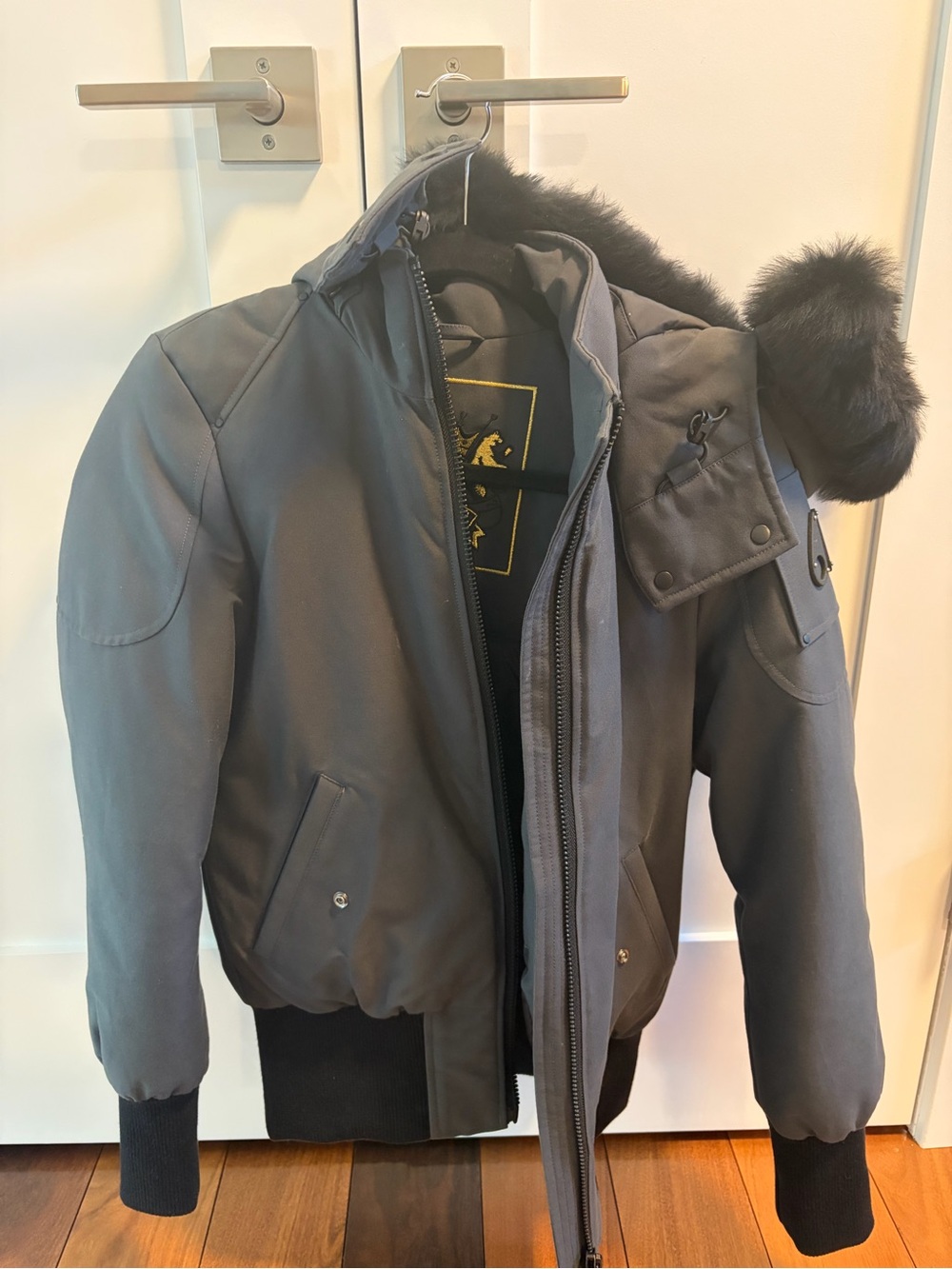 Moose Knuckles Women’s Dark Gray Bomber Jacket with Fur-Trim Hood
